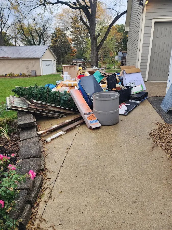 Dumpster being loaded with debris for 3 Yard Dumpster Rental in Eldorado